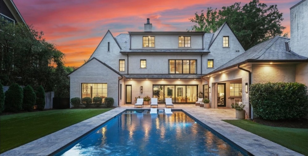 Completed Eastover residence rear elevation and pool at twilight